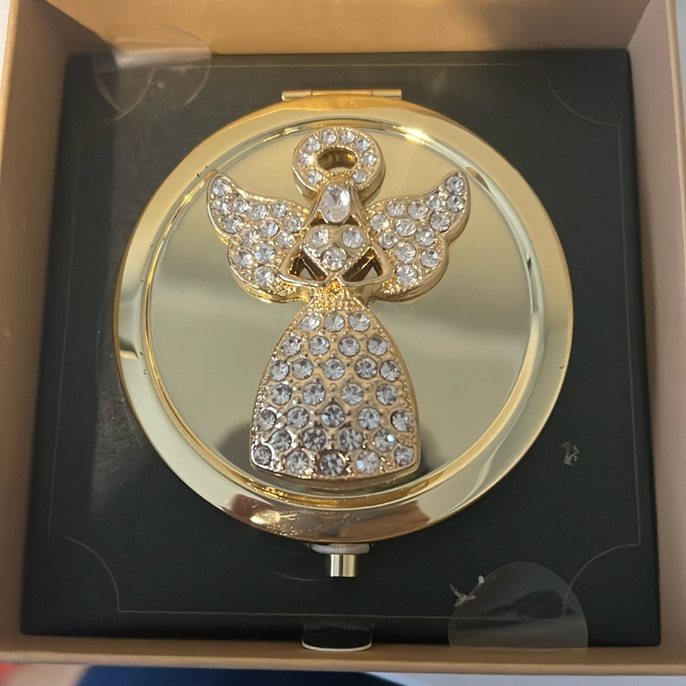 Monet gold mirror with angel on top